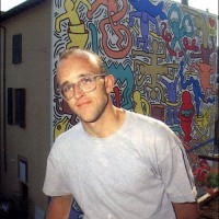 Keith Haring in front of Pisa Mural, 1989